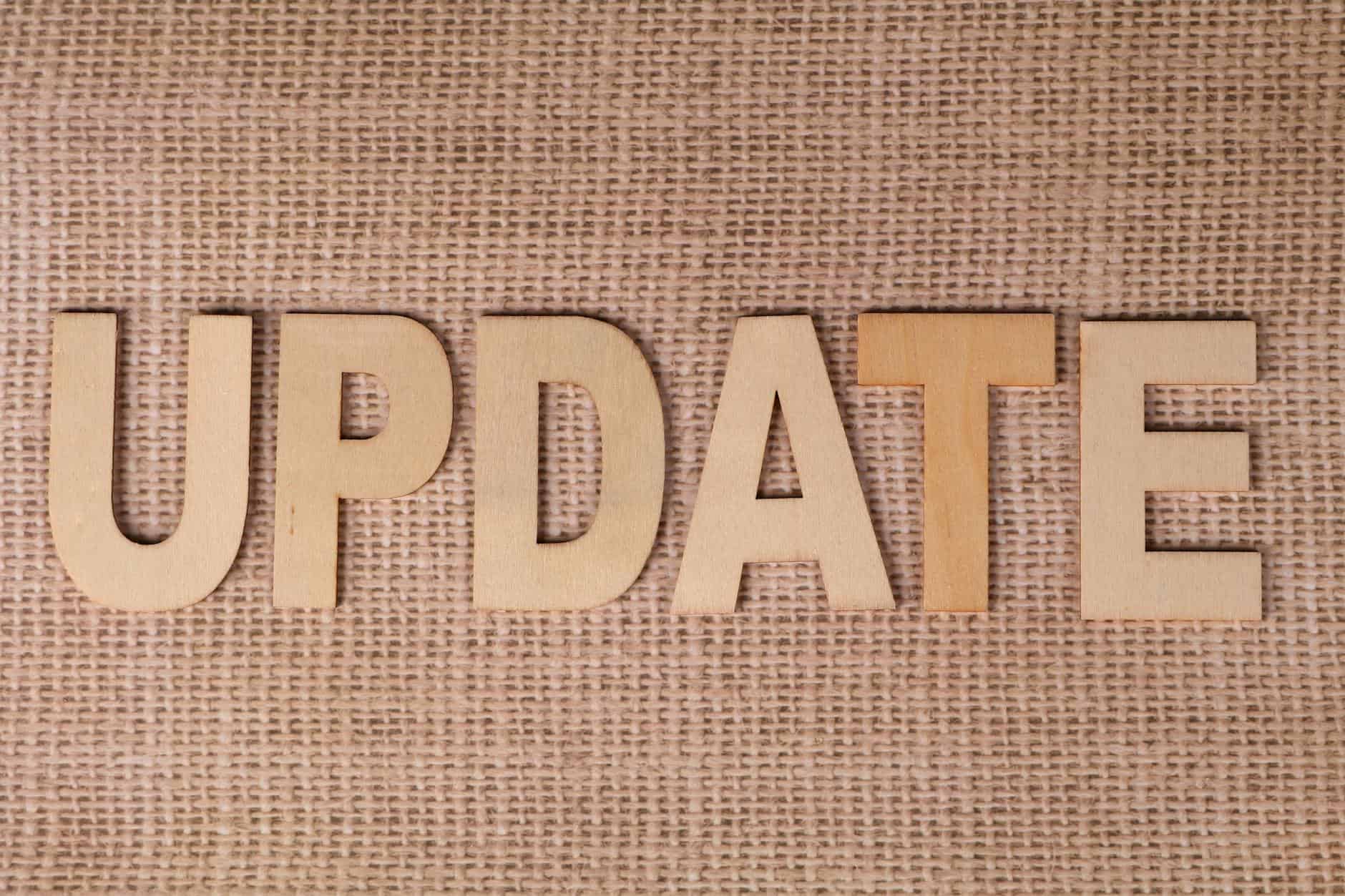 wooden letters spelling update on burlap