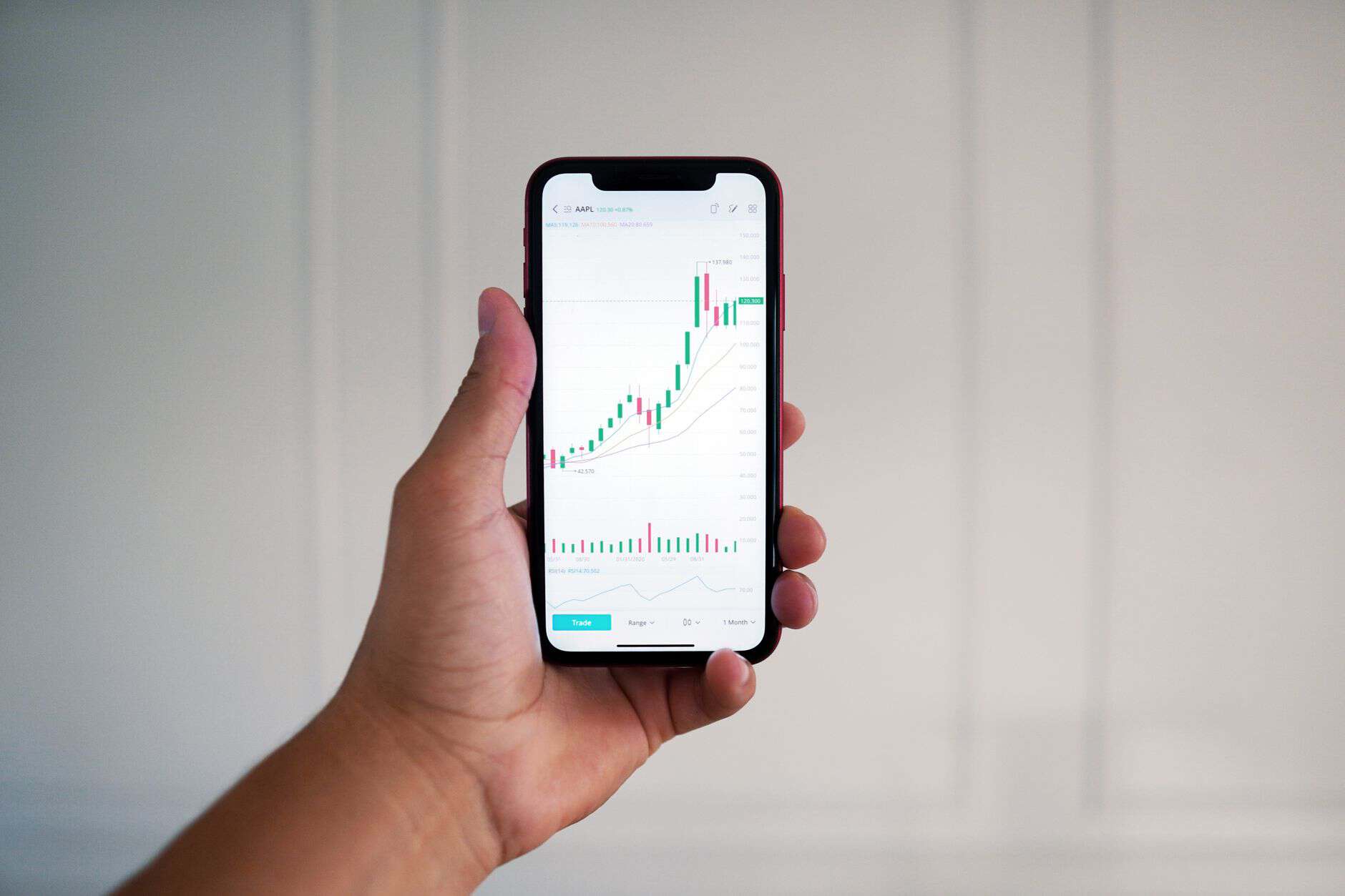 person holding a phone with data on the screen